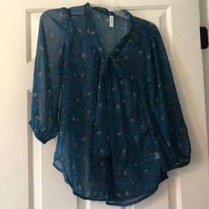 Teal patterned top with tie at neck